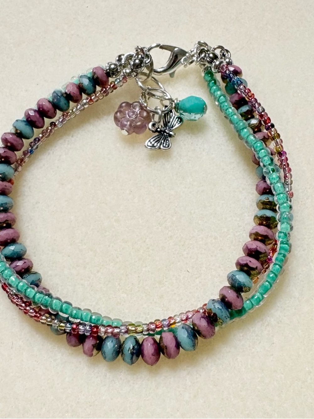 Handcrafted Multi-Strand Beaded Bracelet in Teal & Mauve - Unbranded